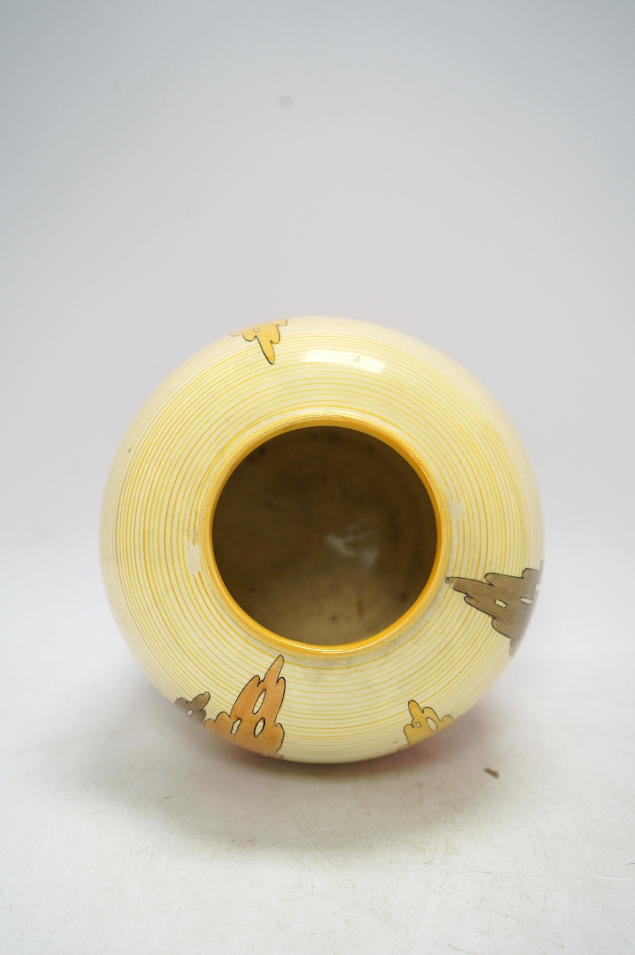 A Clarice Cliff Bizarre vase, Capri pattern,17cm high. Condition - fair to good